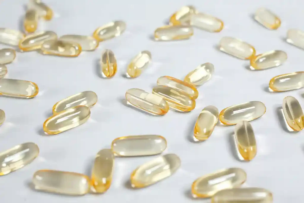 Softgel capsules representing essential daily supplements for foundational health including vitamins and omega-3